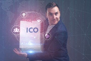 The concept of business, technology, the Internet and the network. A young entrepreneur working on...