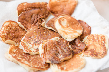 Ready pancakes on a plate. Rosy fresh and tasty pastries. Ready breakfast on a plate.