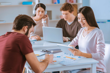 Obraz premium Busy two colleagues immersing in work