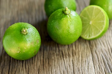 limes slices on wooden table. Detox diet, fresh lime Background, Close up shot, fruit macro photography