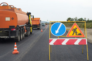 Close view on the road roller working on the new road construction site