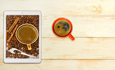Fototapeta na wymiar image of a cup of coffee and a tablet