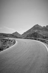 Fototapeta premium Black and white picture of a mountain road.