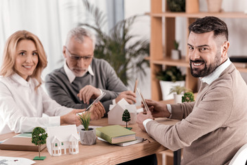 Cheerful ecologist holding a beaker