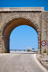 Stone overpass and a mountain road turn, Mallorca, Spain.