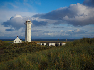 Fototapeta na wymiar Lighthouse in South Walney nature reserve, Walney Island, Cumbria, England