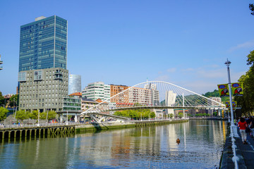 Obraz premium The Bridge “ Zubizuri “of Santiago Calatrava, Bilbao, Spain.