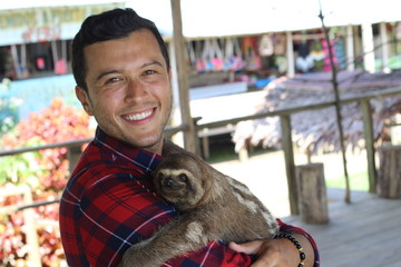  Zookeeper enjoying work with sloth bear © ajr_images
