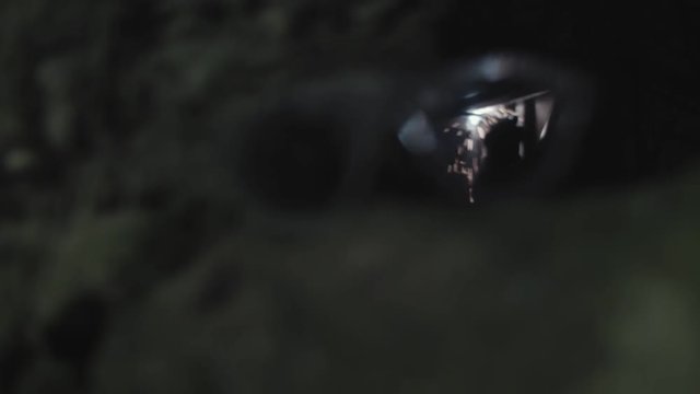 Welding goggles rack focus to reflection of welder