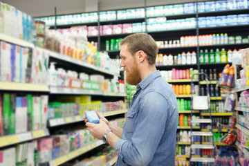 Man near  department with  tools for body care