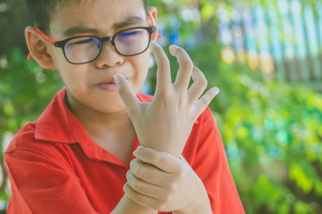Young boy get painful wrist after playground. Accident concept.