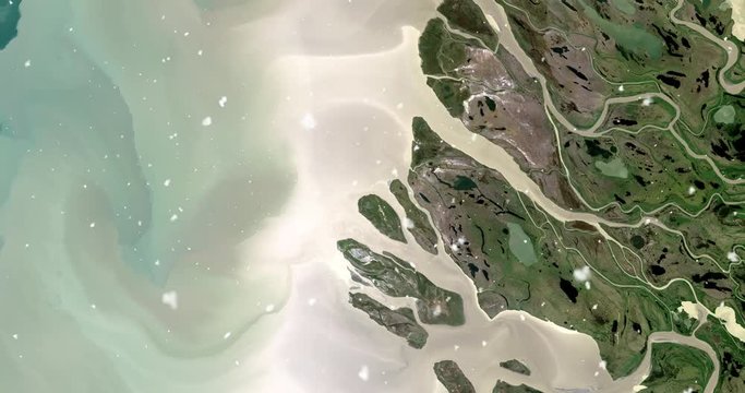 Vertical aerial ascent through light falling snow, over Mackenzie River Delta, Canada. Elements of this image furnished by NASA. 