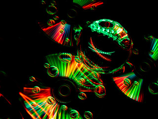 Three flat discs and a Lensball create the abstract art