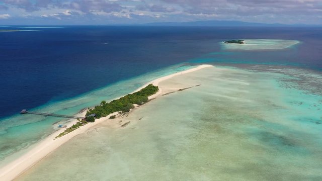 Aerial panoramic view of sandy islet Timba Timba, turquoise crystal clear waters of Celebes Sea, white sand beaches and coral reefs  - landscape panorama of Borneo island, Malaysia, Pacific Ocean