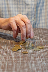 hand elderly woman and coins