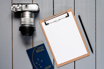 Camera on wooden background.