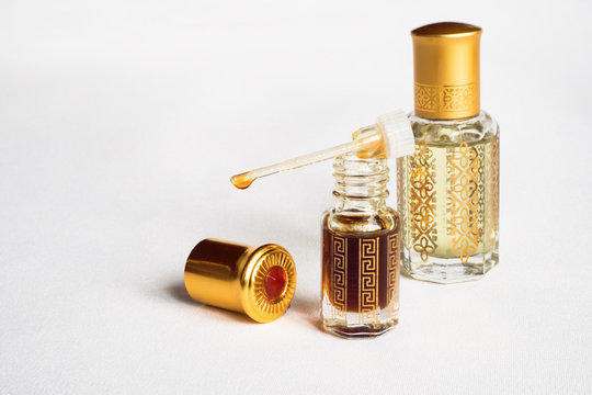 Arabian oud attar perfume or agarwood oil fragrances in mini bottles.