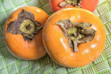 Organic persimmon fruits closeup