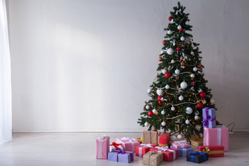 Fototapeta na wymiar Christmas Interior home Christmas tree and gifts new years winter Garland lights