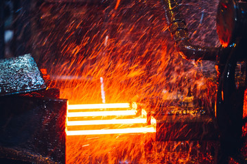 hot steel on conveyor in steel mill
