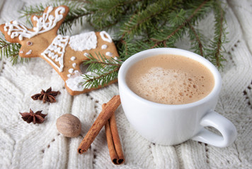 Obraz na płótnie Canvas Coffee in a white cup and a gingerbread