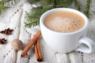 Coffee in a white cup   on a white knitted tablecloth
