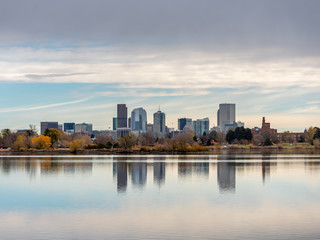 Fototapeta na wymiar Denver Skyline Reflected in the Water During Dusk on Fall Season
