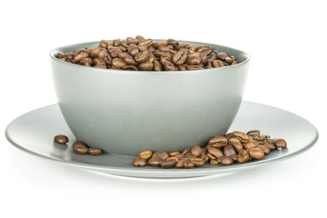 Lot of whole roasted dark brown coffee beans sweet arabica variety in a grey ceramic bowl isolated on white background