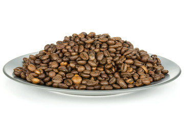 Lot of whole dark brown coffee beans sweet arabica variety on grey ceramic plate isolated on white background