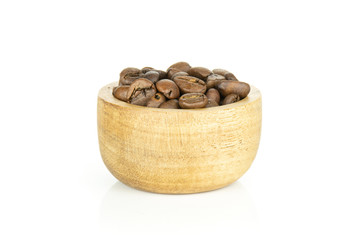 Lot of whole dark brown coffee beans sweet arabica variety with wooden bowl isolated on white background