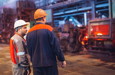 Workers in the steel mill.