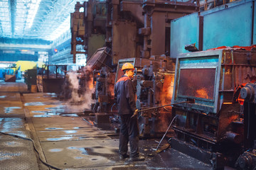Workers in the steel mill.