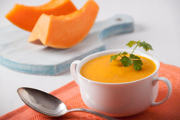 Pumpkin cream soup in a white plate