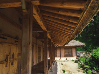 Fototapeta na wymiar The wooden roof of asian house in the traditional village. Bottom view, South Korea