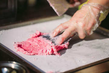 stir-fried ice cream rolls at freeze pan. Organic, natural rolled ice cream, hand made dessert.