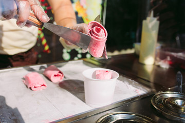 stir-fried ice cream rolls at freeze pan. Organic, natural rolled ice cream, hand made dessert.