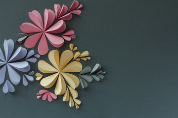 Handmade origami heart shaped paper flowers. Valentine's day or celebration background.