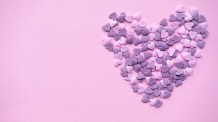 Decorative heart on pink background. Copy space.