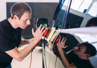 Polishing the car body.