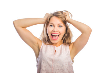 Close-up photo of a girl holding her head screaming, woman's emotions, negative emotions