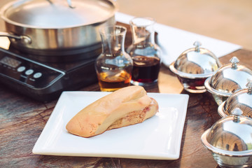 Goose liver on a wooden Board in the restaurant before cooking. © davit85