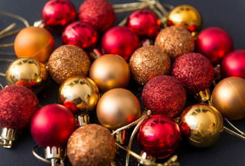 red and Golden Christmas balls on black background