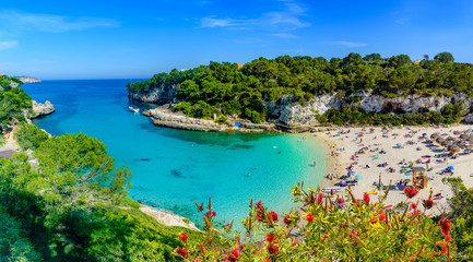 Exotic bay resort in Cala Llombards beach, Mallorca island of Spain. Summer holiday in a paradise place - obrazy, fototapety, plakaty
