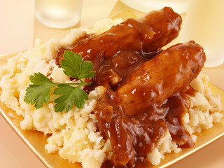 BANGERS AND MASH WITH ONION GRAVY