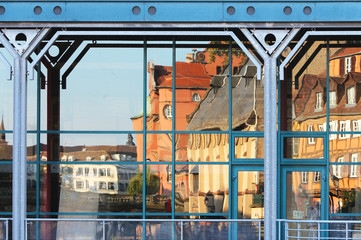 Image of old town Strasbourg (France) reflected in modern glazed building