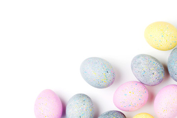 Background with pale pink, blue, yellow and gray Easter eggs. Compositions in pastel colors.  Easter concept
