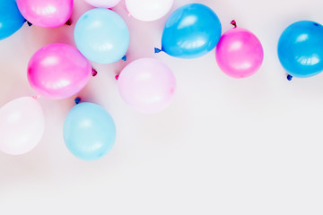 Colorful balloons on pastel color background. Festive or birthday party concept. Flat lay, top view.