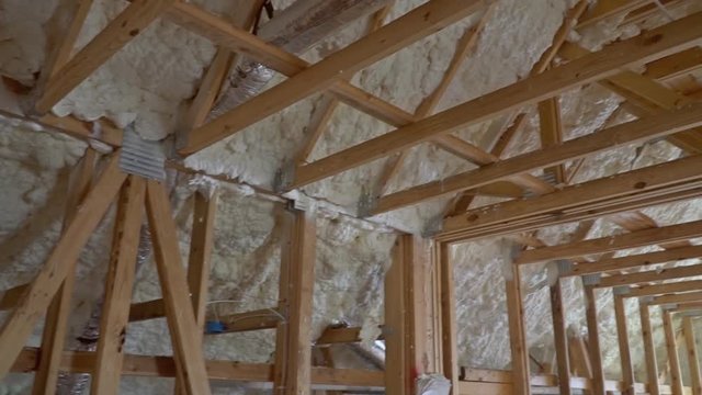 Closeup on termal insulation installing at the attic insulation of the house