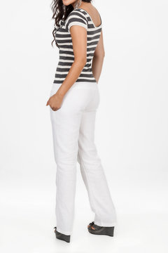 female clothes, lady dressed in striped shirt and white pants on neutral background