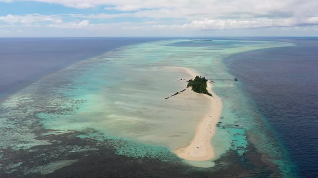 Aerial panoramic view of sandy islet Timba Timba, turquoise crystal clear waters of Celebes Sea, white sand beaches and coral reefs  - landscape panorama of Borneo island, Malaysia, Pacific Ocean